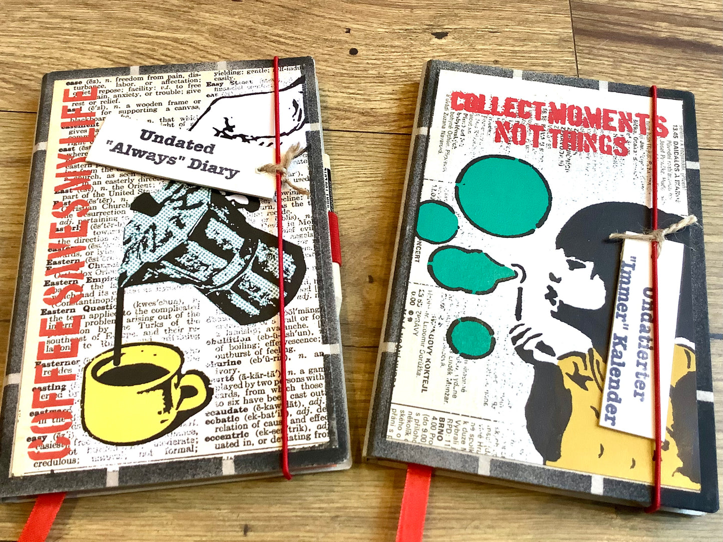 Außenansicht von zwei Motiven eines Tagebuchs in A5 - Cover im Banksy-Schablonen-Stil mit rotem Gummiband-Verschluss. Zu kaufen bei Polly Paper - Umweltfreundliche Schreibwaren in Berlin Mitte