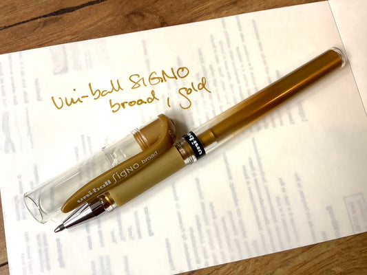 Gelschreiber Uniball Signo broad in gold